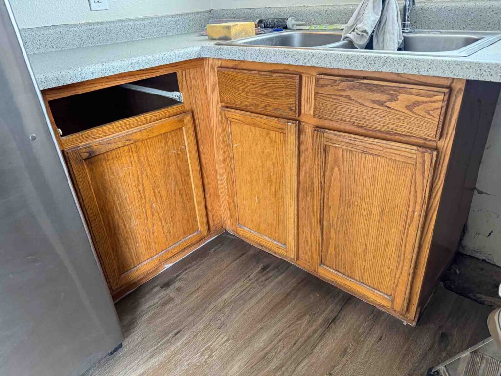 a kitchen with a sink and cabinets