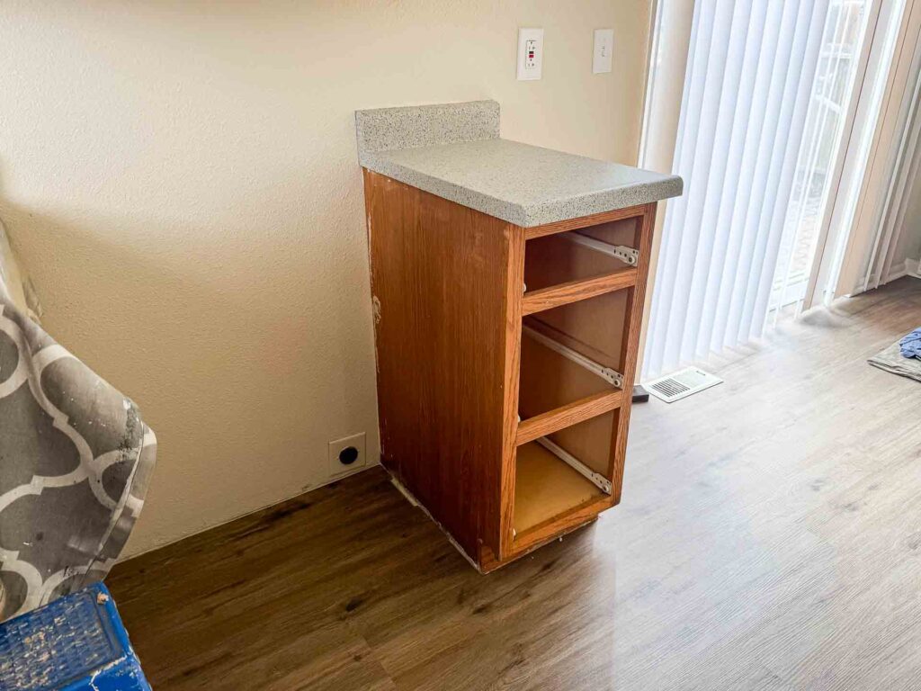 a cabinet with shelves in a room