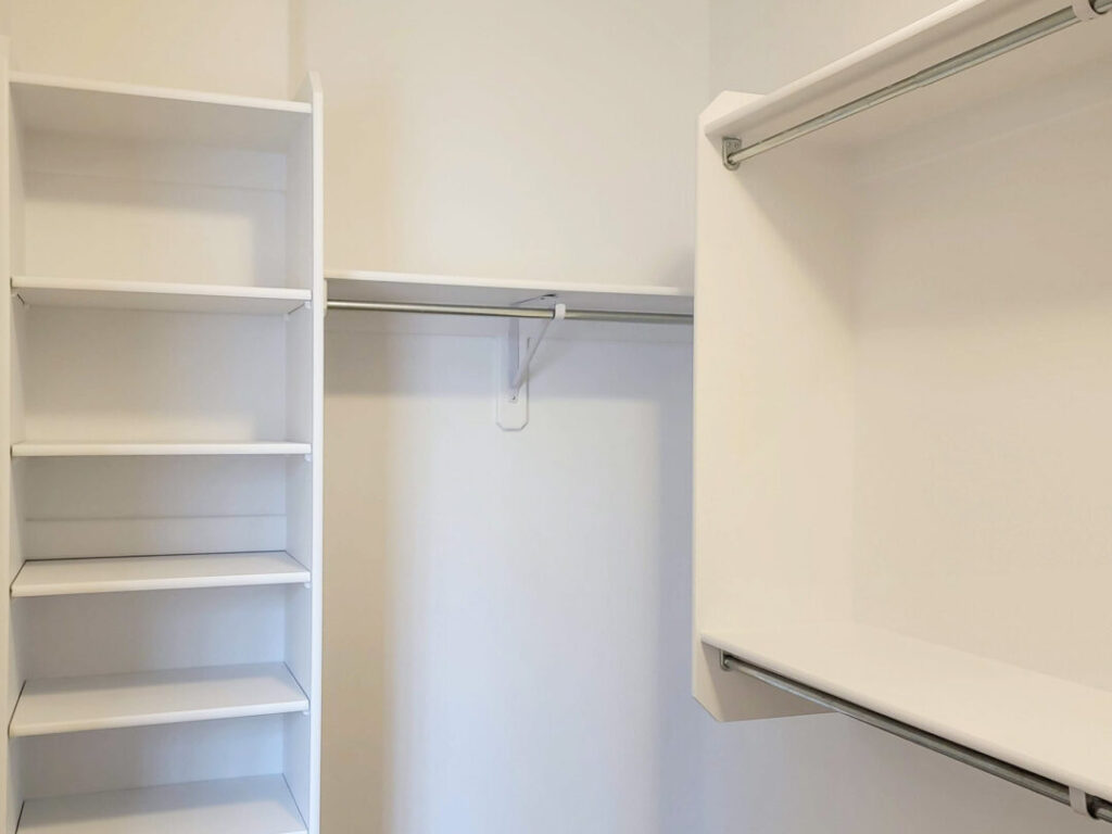 a white closet with shelves